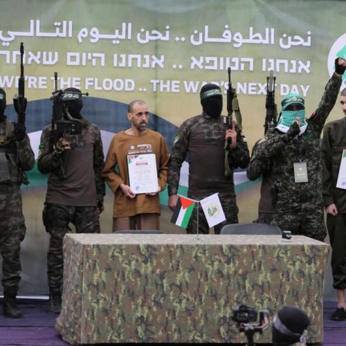 FILE PHOTO: Or Levy, Eli Sharabi and Ohad Ben Ami, hostages held in Gaza since the deadly October 7, 2023 attack, are released by Hamas militants as part of a ceasefire and a hostages-prisoners swap deal between Hamas and Israel in Deir Al-Balah in the central Gaza Strip, February 8, 2025. REUTERS/Hatem Khaled/File Photo