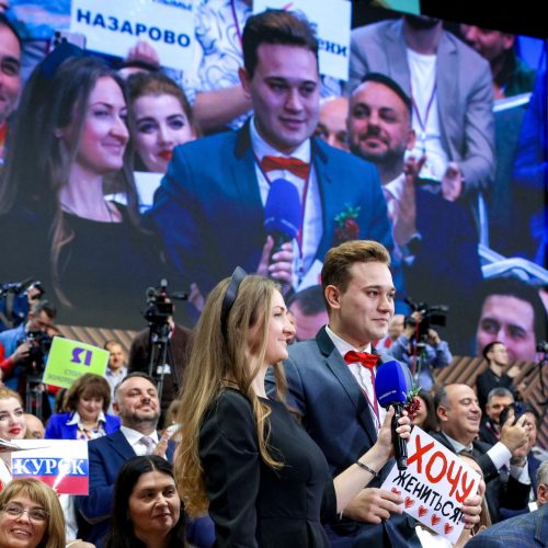 Journalist Kirill Bazhanov holds a placard reading "I want to get married!" during Russian President Vladimir Putin's annual end-of-year press conference and phone-in in Moscow, Russia December 19, 2025. Sputnik/Gavriil Grigorov/Pool via REUTERS ATTENTION EDITORS - THIS IMAGE WAS PROVIDED BY A THIRD PARTY.