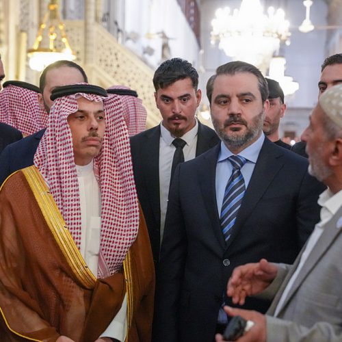 Syrian Foreign Minister Asaad Sheibani (center) stands alongside Saudi Foreign Minister Faisal bin Farhan (left) during a tour of the Umayyad Mosque, in Damascus, on May 31, 2025. (Photo by Rami Alsayed/NurPhoto via Getty Images)