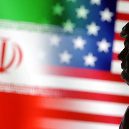 FILE PHOTO: A 3D-printed miniature model of Donald Trump and the U.S. and Iran flags are seen in this illustration taken January 15, 2025. REUTERS/Dado Ruvic/Illustration/File Photo