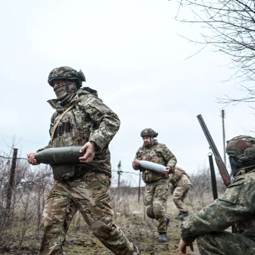 Soldiers of an artillery crew of the Rifle Battalion Special Unit of the Main Department of the National Police in the Zaporizhzhia region unload ammunition in the Zaporizhzhia region, Ukraine, on January 11, 2025. NO USE RUSSIA. NO USE BELARUS. (Photo by Ukrinform/NurPhoto) (Photo by Dmytro Smolienko / NurPhoto / NurPhoto via AFP)
