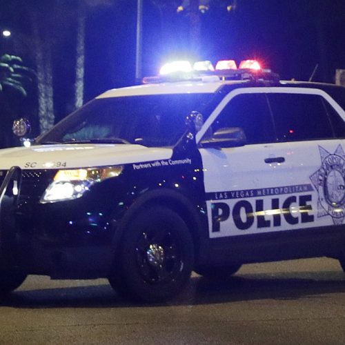 FILE - A Las Vegas Metropolitan Police vehicle is stationed at the Las Vegas Strip on Sunday, Oct. 1, 2017. Several fatal police encounters in Las Vegas that didn't involve a gun from 2012 through 2021, involved subjects who had a history of mental illness and who were using stimulants, particularly meth. (AP Photo/John Locher, File)