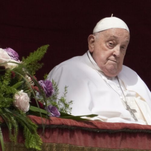 Pope Francis appears on the central lodge of St. Peter's Basilica to bestow the Urbi et Orbi (Latin for to the city and the world) blessing at the end of the Easter mass presided over by Cardinal Angelo Comastri in St. Peter's Square at the Vatican Sunday, April 20, 2025.  (AP Photo/Gregorio Borgia)