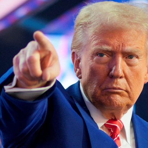 FILE PHOTO: U.S. President-elect Donald Trump gestures at Turning Point USA's AmericaFest in Phoenix, Arizona, U.S., December 22, 2024. REUTERS/Cheney Orr/File Photo