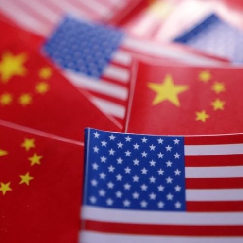 FILE PHOTO: U.S. and Chinese flags are seen in this illustration taken March 20, 2025. REUTERS/Dado Ruvic/Illustration/File Photo