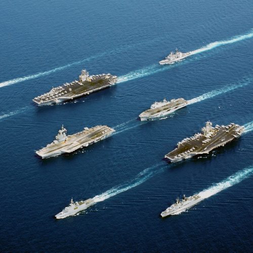 Naval vessels from five nations sail in parade formation for a rare photographic opportunity at sea.  From top row left to right: the Italian Navy (Marina Militare) ship Maestrale Class Frigate MM MAESTRALE (F 570), French Navy Tourville Class Destroyer DE GRASSE (D 612), Nimitz Class Aircraft Carrier USS JOHN C. STENNIS (CVN 74), US Navy (USN) Ticonderoga Class Cruisers USS PORT ROYAL (CG 73), French Navy Charles de Gaulle Class Aircraft Carrier CHARLES DE GAULLE (R 91), Royal Navy Helicopter Carrier, Her MajestyÕs Ship (HMS) OCEAN (L 12), French La Fayette Class Frigate SURCOUF (F 711), Aircraft Carrier USS JOHN F. KENNEDY (CV 67), Netherlands Navy Karel Doorman Class Frigate Her MajestyÕs Netherlands Ship (Harer Majesteits) (HNLMS) VAN AMSTEL (F 831), Italian Navy De La Penne (ex-Animoso) Class Destroyer, MM LUIGI DURAND DE LA PENNE (ex Animoso) (D 560).   The coalition forces are deployed in support of Operation ENDURING FREEDOM.