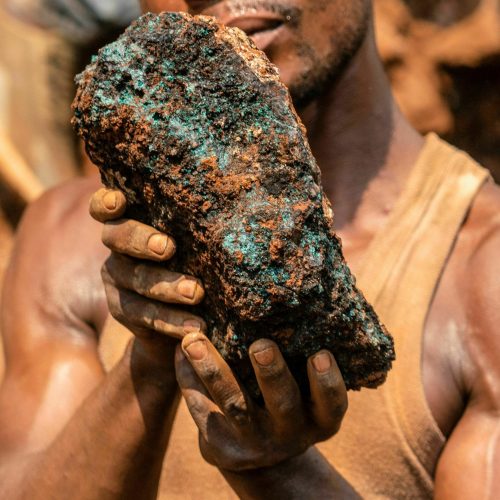 Dela wa Monga, an artisanal miner, holds a cobalt stone at the Shabara artisanal mine near Kolwezi on October 12, 2022. - Some 20,000 people work at Shabara, in shifts of 5,000 at a time.
Congo produced 72 percent of the worlds cobalt last year, according to Darton Commodities. And demand for the metal is exploding due to its use in the rechargeable batteries that power mobile phones and electric cars.
But the countrys poorly regulated artisanal mines, which produce a small but not-negligeable percentage of its total output, have tarnished the image of Congolese cobalt. (Photo by Junior KANNAH / AFP) (Photo by JUNIOR KANNAH/AFP via Getty Images)