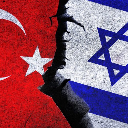 Israel vs Turkey concept flag on wall with crack. Israel and Turkey political conflict, economy, war crisis, relationship, trade concept