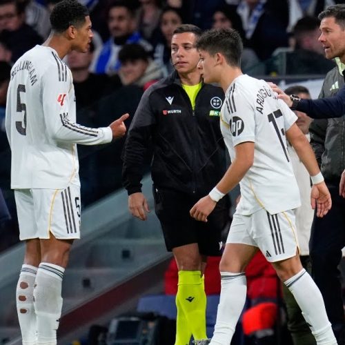 Real Madrid's head coach Xabi Alonso sends on Arda Guler and Jude Bellingham speaks to the fourth official during the Spanish La Liga soccer match between Real Madrid and Celta Vigo in Madrid, Spain, Sunday, Dec. 7, 2025. (AP Photo/Manu Fernandez)