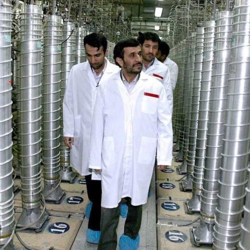 Former Iranian President Mahmoud Ahmadinejad inspects the Natanz nuclear plant in central Iran on March 8, 2007. The tall cylinders are centrifuges for enriching uranium.