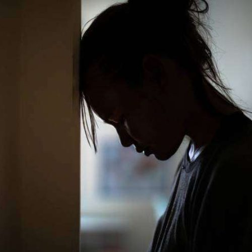 A woman suffering from deep depression and sorrow.