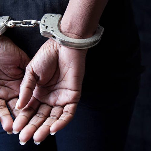 Black woman in handcuffs