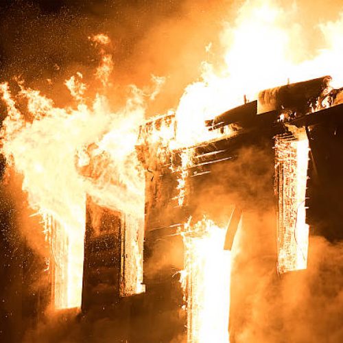 Photo of Huge Flame Distracting House on Fire. Fire Safety Concept