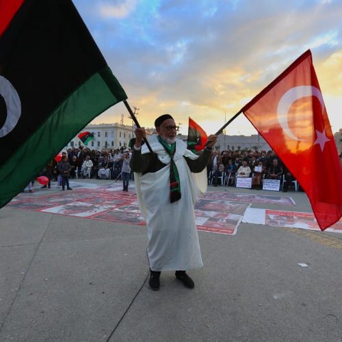 TRIPOLI, LIBYA - JANUARY 10: An old man holds flags of Turkey and Libya during a demonstration against eastern military commander Khalifa Haftar, who is based in the east of the country, and in support of the UN-recognised government of national accord (GNA) at Martyrs' Square in Tripoli on January 10, 2020. Hazem Turkia / Anadolu Agency