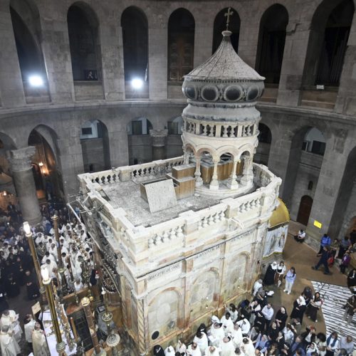 Clergy and worshippers take part in a Mass led by Latin Patriarch Pierbattista Pizzaballa, the top Catholic clergyman in the Holy Land, in remembrance of Pope Francis at the Church of the Holy Sepulcher, the site where according to tradition Jesus was crucified and buried, in the Old City of Jerusalem, Wednesday, April 23, 2025. (AP Photo/Mahmoud Illean)