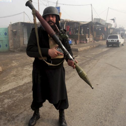 An armed paramilitary soldier stands guard after a suicide bomber blew himself up close to a police checkpoint in Peshawar, Pakistan January 19, 2016.    REUTERS/Fayaz Aziz