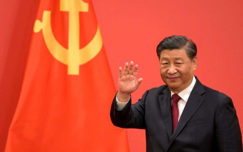 China's President Xi Jinping waves during the introduction of members of the Chinese Communist Party's new Politburo Standing Committee, the nation's top decision-making body, to the media in the Great Hall of the People in Beijing on October 23, 2022. (Photo by WANG Zhao / AFP) (Photo by WANG ZHAO/AFP via Getty Images)