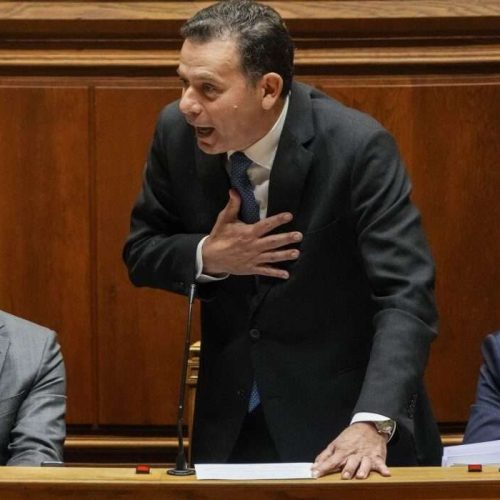 Portuguese Prime Minister Luis Montenegro, center, talks during a debate preceding a confidence motion vote at the Portuguese parliament in Lisbon, Tuesday, March 11, 2025. (AP Photo/Armando Franca)