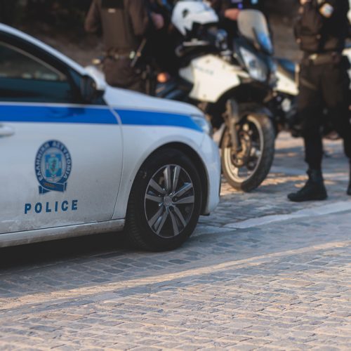 Hellenic Police with "Greek Police" logo emblem on uniform, Greek police squad on duty maintain public order in the streets of Athens, Attica, Greece, group of policemen