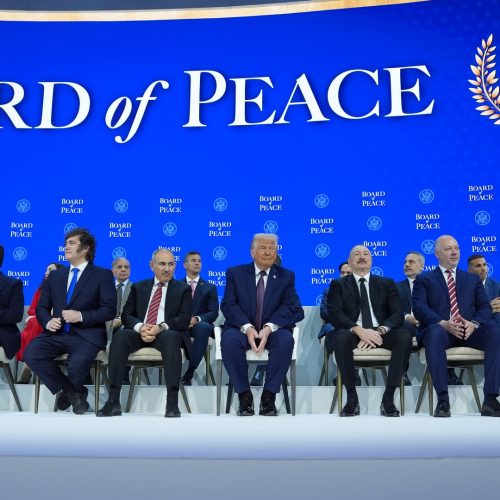 President Donald Trump, center, poses with international leaders after the signing of a Board of Peace charter during the Annual Meeting of the World Economic Forum in Davos, Switzerland, Thursday, Jan. 22, 2026. (AP Photo/Evan Vucci)