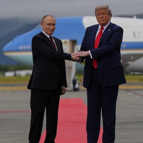 President Donald Trump greets Russia's President Vladimir Putin Friday, Aug. 15, 2025, at Joint Base Elmendorf-Richardson, Alaska. (AP Photo/Julia Demaree Nikhinson)