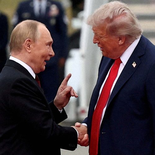 FILE PHOTO: U.S. President Donald Trump shakes hand with Russian President Vladimir Putin, as they meet to negotiate for an end to the war in Ukraine, at Joint Base Elmendorf-Richardson in Anchorage, Alaska, U.S., August 15, 2025. REUTERS/Kevin Lamarque/File Photo