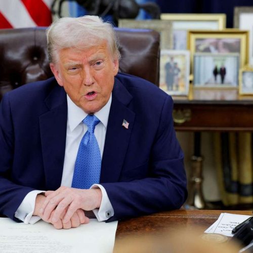 U.S. President Donald Trump looks on as he signs an executive order in the Oval Office at the White House in Washington, U.S., January 31, 2025. REUTERS/Carlos Barria