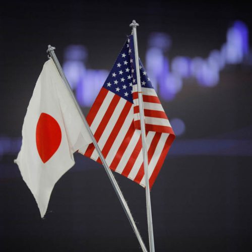 U.S. and Japanese flags are displayed at a foreign exchange firm in Tokyo Wednesday, Feb. 22, 2012. The dollar rose to the 80-yen mark Wednesday for the first time since Aug. 4 in midday Tokyo time. (AP Photo/Itsuo Inouye)